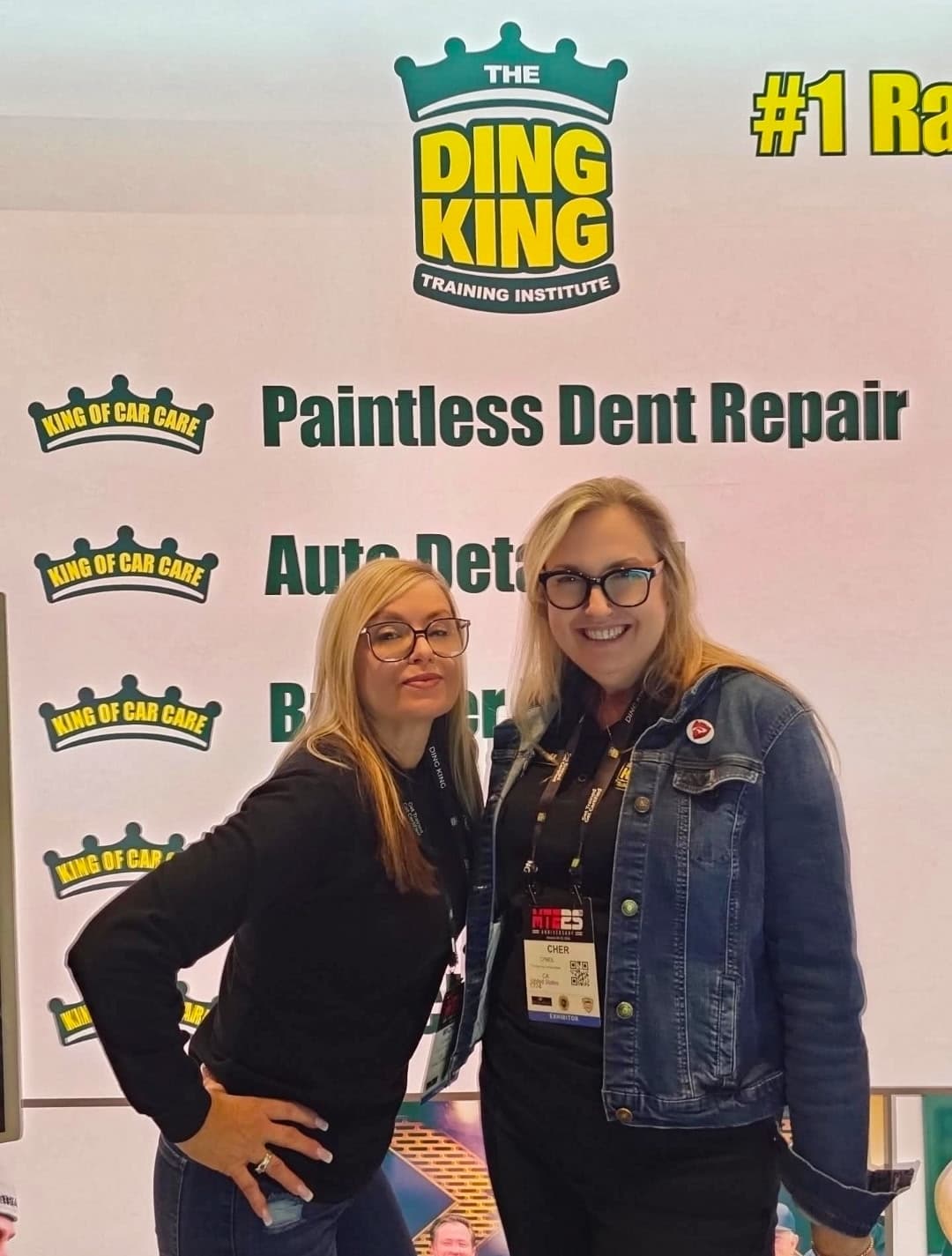 Two members of the school admissions team at the Ding King Training Institute booth