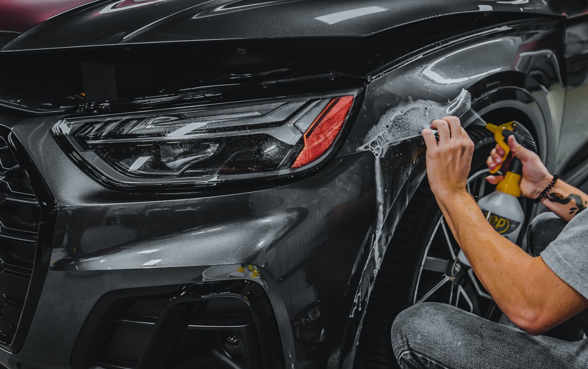 Paint protection film being installed on a vehicle panel