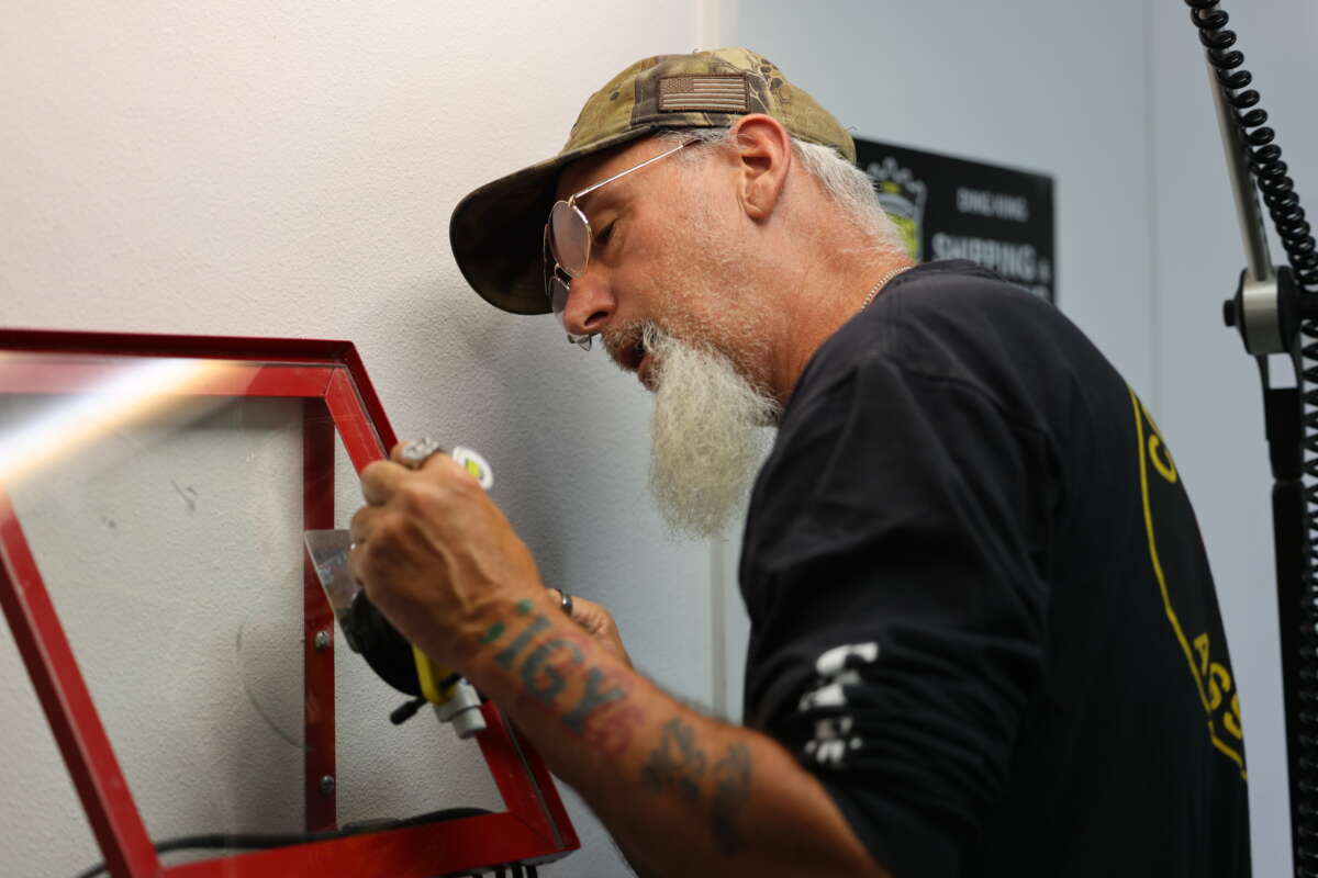 A technician performing a windshield glass repair